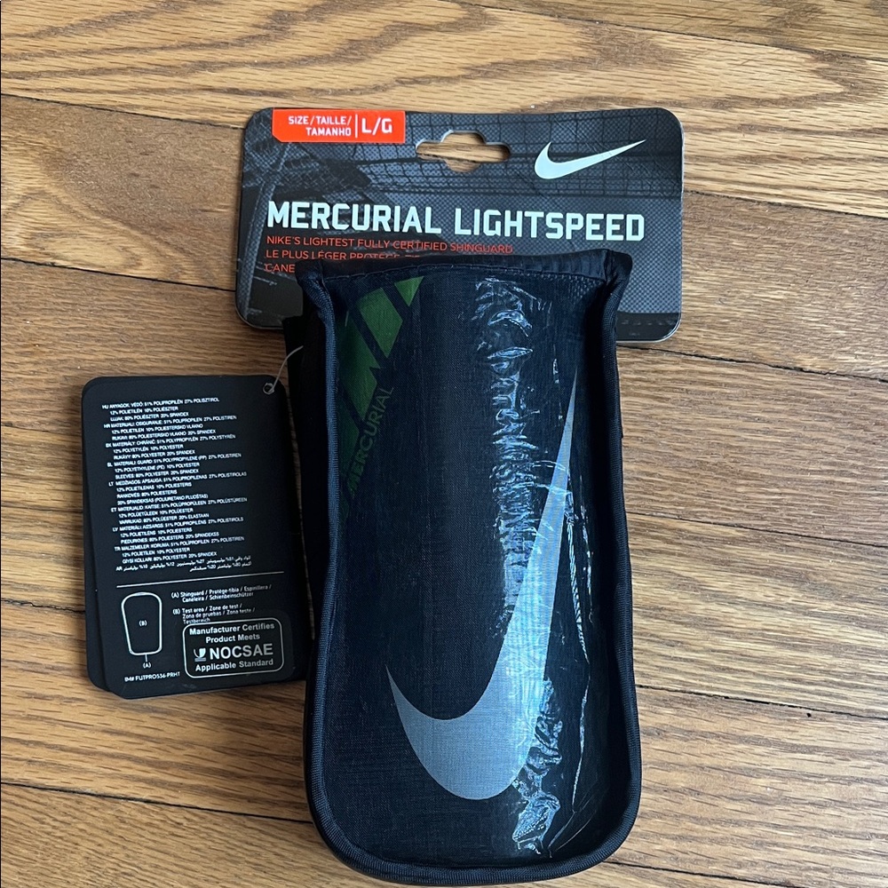 Nike mercurial light speed shin guards, size large, new in package